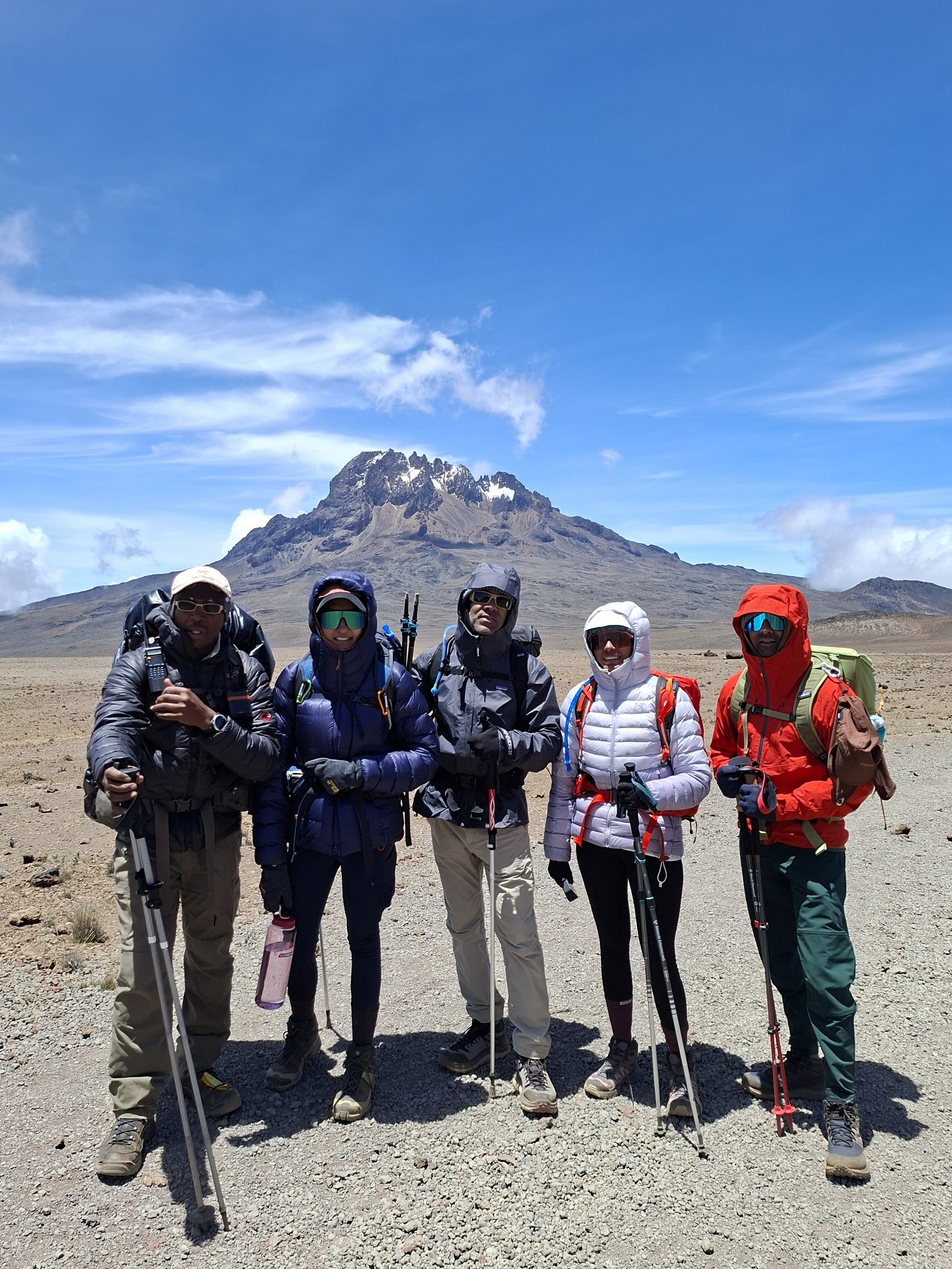 Kilimanjaro guides and climbers standing together on the high saddle of the mountain