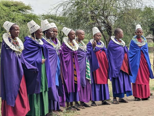 Maasai women in traditional dress and beaded headpieces.