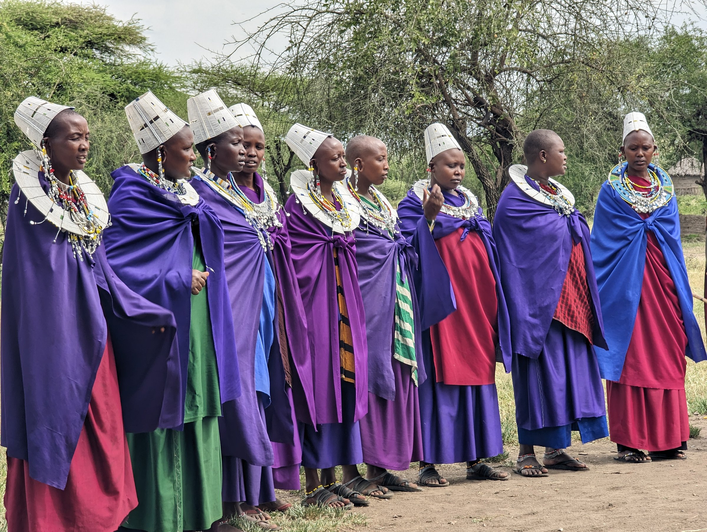 Maasai women in traditional dress and beaded headpieces.