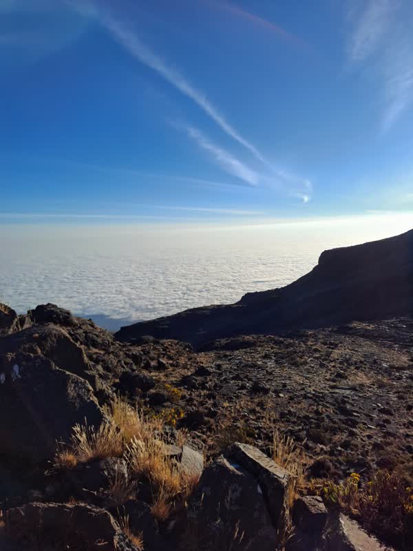 Late afternoon above the cloud sea from the Mawenzi Tarn camp, the moorland dropping away below.